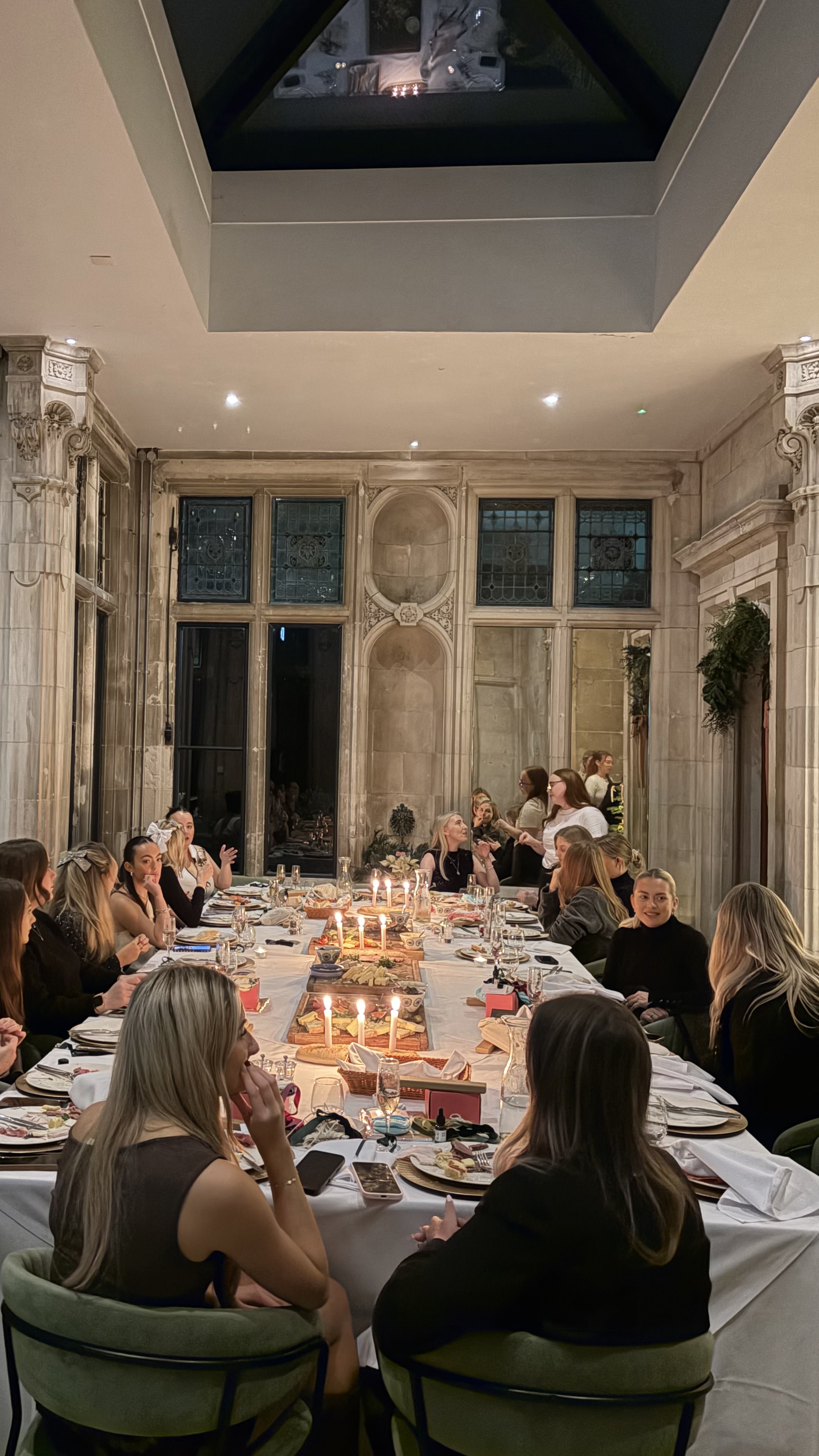 Women enjoying post-Pilates meal with decorated table